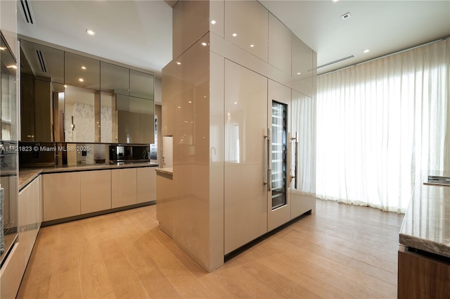 kitchen featuring a wealth of natural light and light wood-type flooring