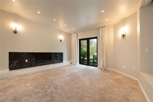 unfurnished living room with light carpet