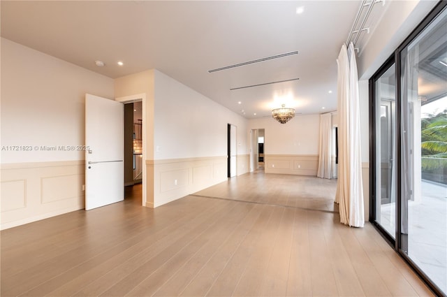 unfurnished room featuring light hardwood / wood-style flooring