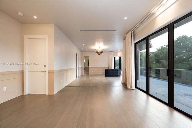 empty room with hardwood / wood-style flooring