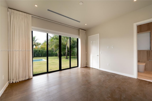 spare room with dark hardwood / wood-style floors