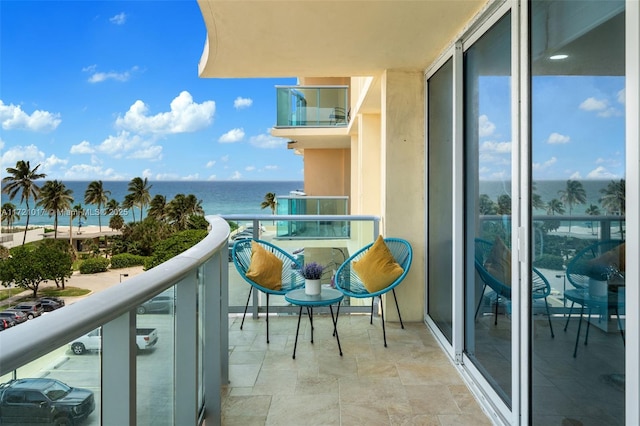 balcony featuring a water view