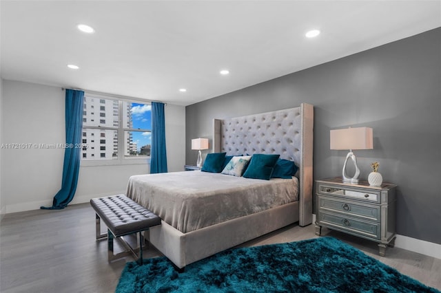 bedroom featuring hardwood / wood-style floors