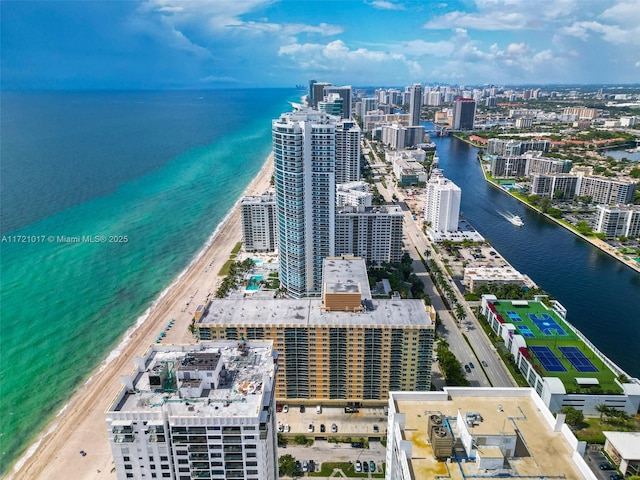 bird's eye view featuring a beach view and a water view