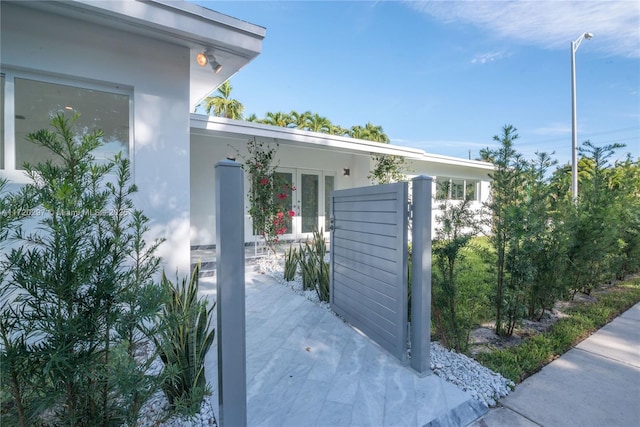 view of side of home featuring french doors