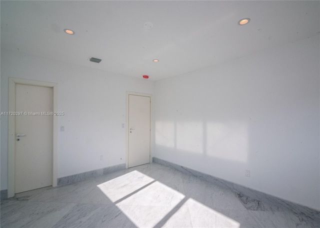 unfurnished room featuring visible vents and recessed lighting