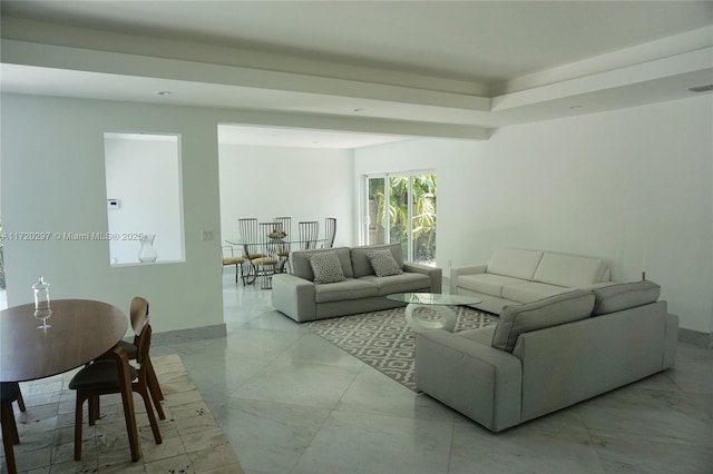 living room featuring marble finish floor and visible vents