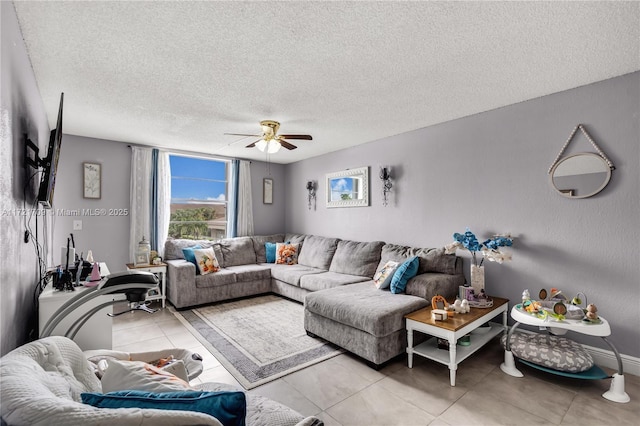 tiled living room with ceiling fan and a textured ceiling