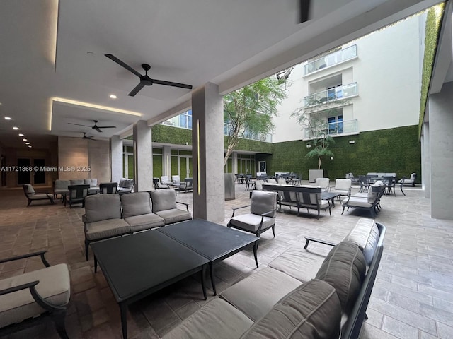 view of patio featuring an outdoor living space and ceiling fan