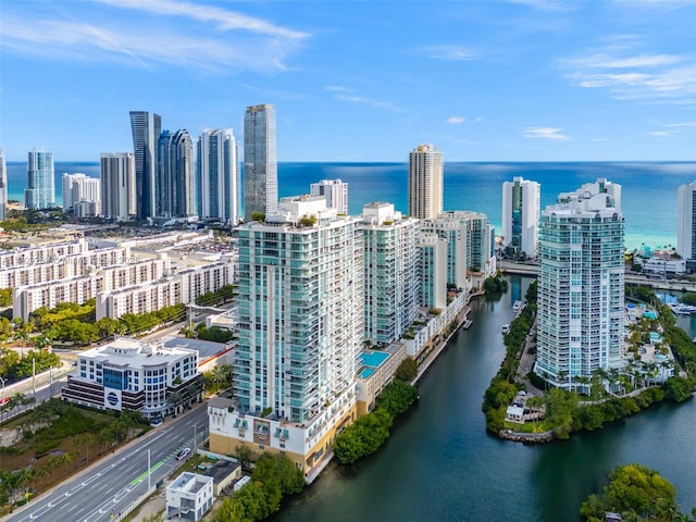 aerial view featuring a water view and a view of city