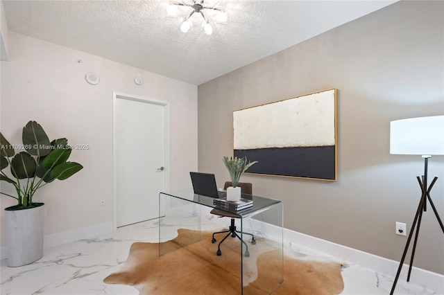 office space featuring marble finish floor, a textured ceiling, and baseboards