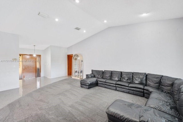 living room featuring vaulted ceiling