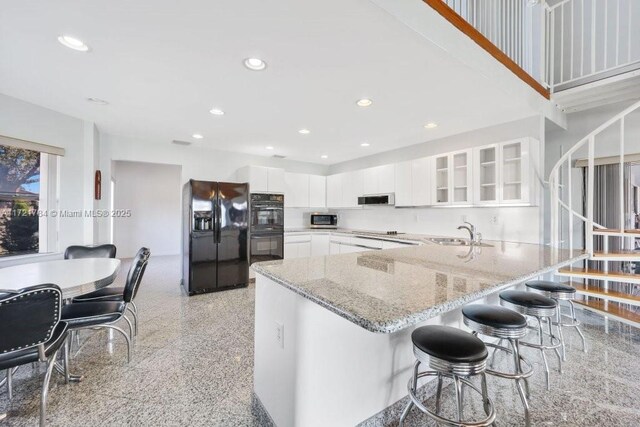 11340 SW 1st St, Coral Springs, FL 33071 - living area featuring wood ceiling, high vaulted ceiling, a wealth of natural light, and stairway