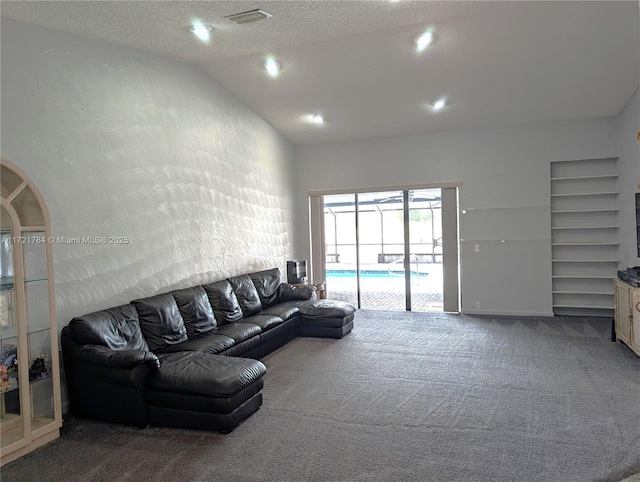 11340 SW 1st St, Coral Springs, FL 33071 - carpeted living area featuring recessed lighting, a textured ceiling, visible vents, lofted ceiling, and built in shelves
