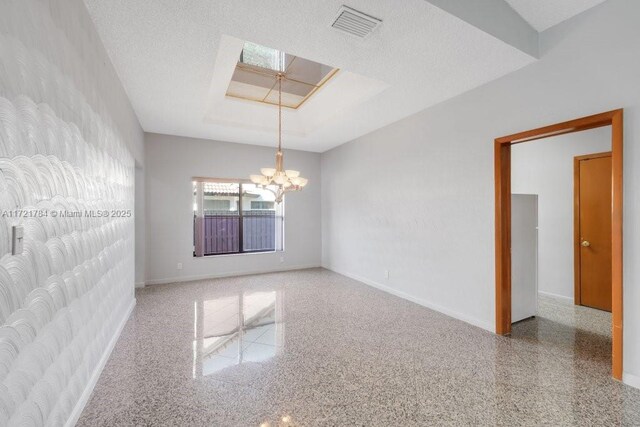 11340 SW 1st St, Coral Springs, FL 33071 - unfurnished room featuring a skylight, an inviting chandelier, baseboards, and visible vents