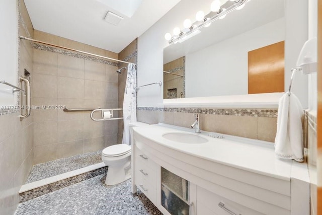 11340 SW 1st St, Coral Springs, FL 33071 - bathroom featuring tiled shower, vanity, visible vents, toilet, and tile walls