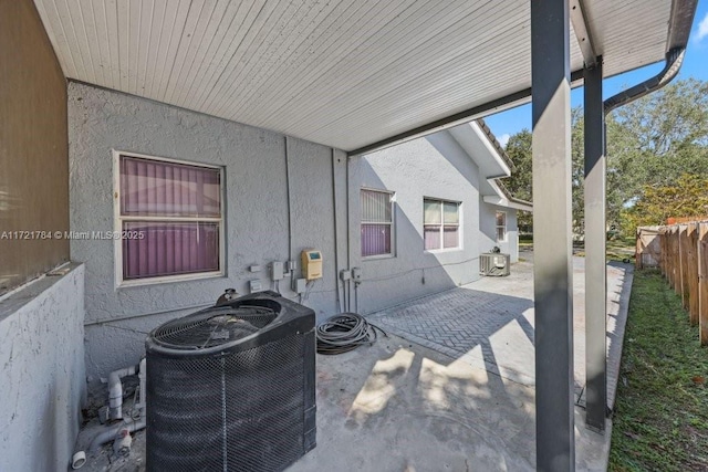11340 SW 1st St, Coral Springs, FL 33071 - view of patio / terrace with central air condition unit and fence