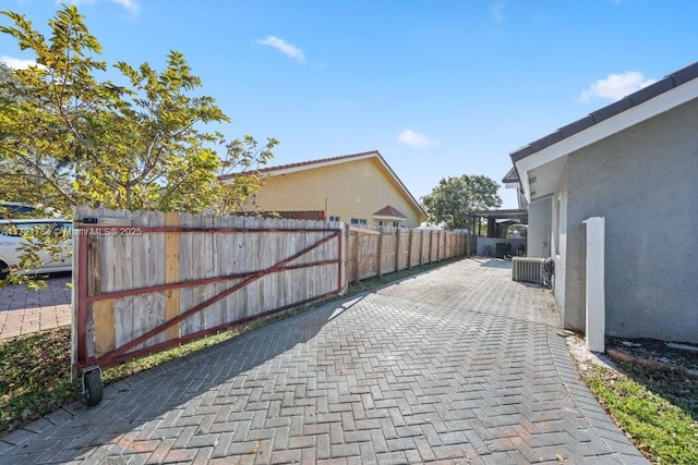 11340 SW 1st St, Coral Springs, FL 33071 - back of house with a yard, an outdoor pool, a tiled roof, and stucco siding