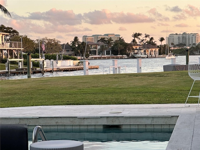 exterior space featuring a water view, a yard, and a dock