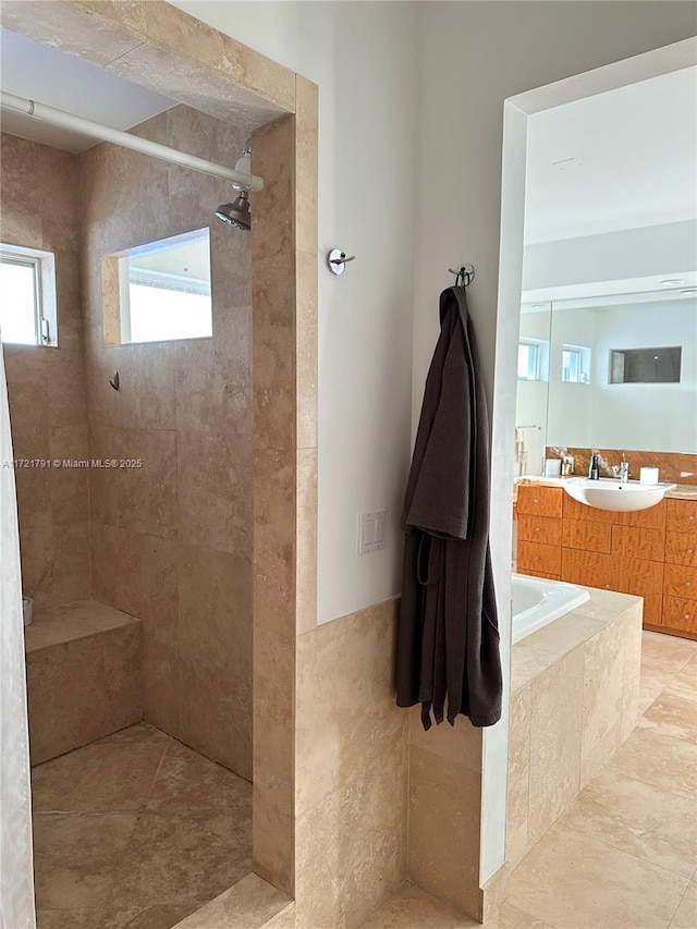 bathroom featuring sink and tiled shower