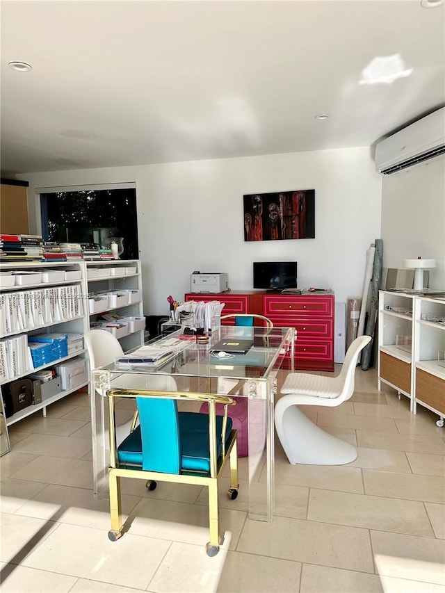 dining area featuring light tile patterned floors and a wall unit AC