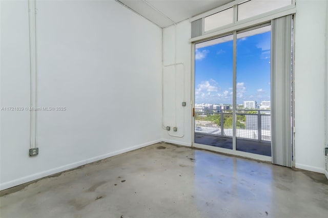 empty room with concrete flooring