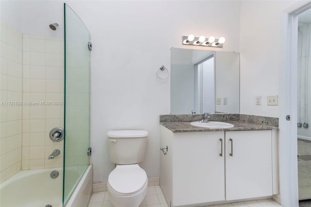 full bathroom featuring tile patterned floors, vanity, bath / shower combo with glass door, and toilet