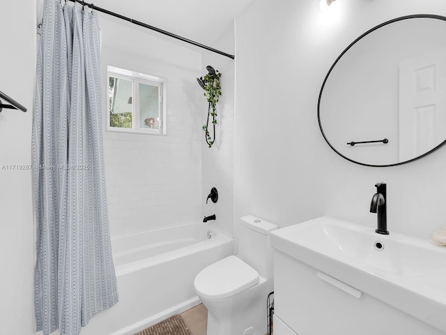 full bathroom featuring sink, shower / bath combo with shower curtain, and toilet