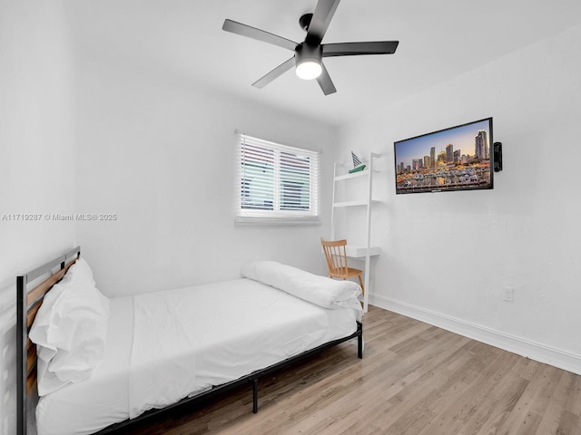 bedroom featuring ceiling fan and light hardwood / wood-style flooring