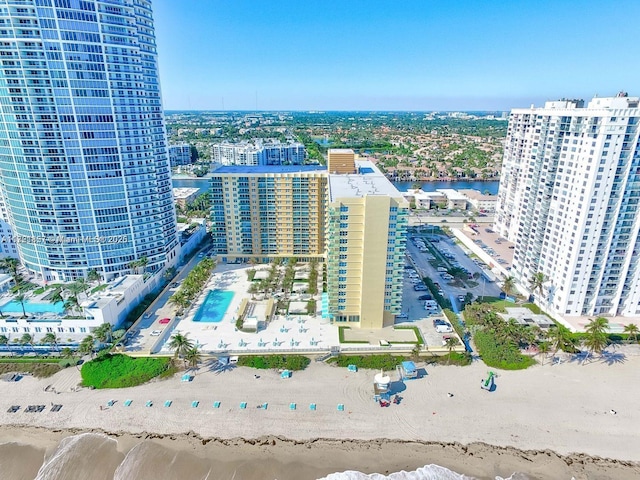 bird's eye view with a view of the beach, a water view, and a city view