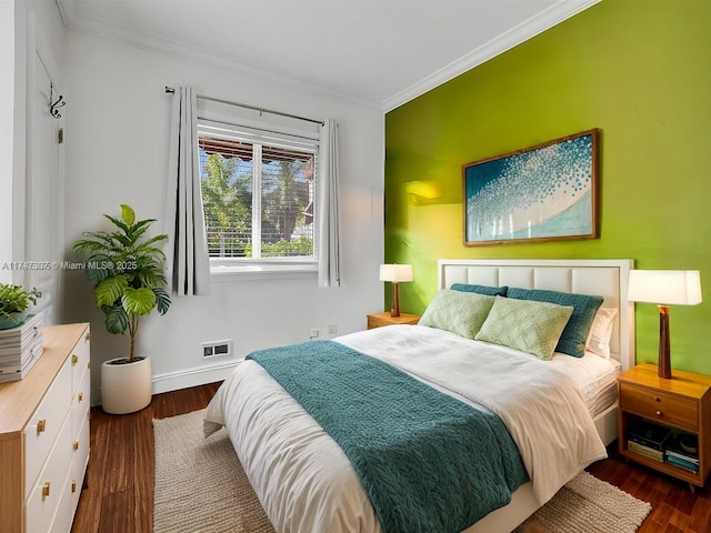 bedroom with dark hardwood / wood-style flooring and crown molding