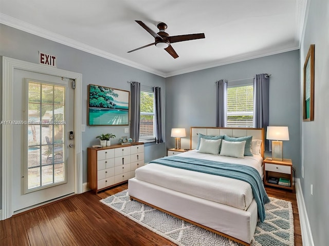 bedroom featuring multiple windows, dark hardwood / wood-style floors, ceiling fan, and crown molding