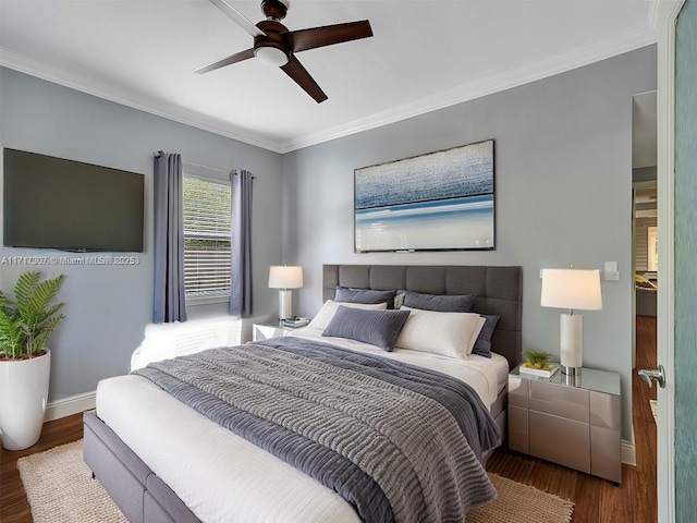 bedroom featuring ceiling fan, crown molding, and dark wood-type flooring