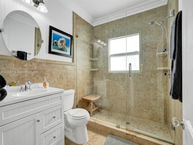 bathroom with tile patterned flooring, vanity, toilet, and crown molding