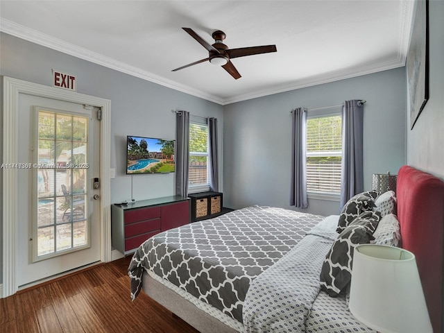 bedroom with multiple windows, hardwood / wood-style floors, ceiling fan, and crown molding