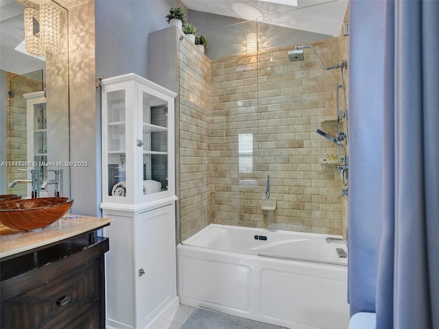 bathroom featuring vanity and tiled shower / bath combo