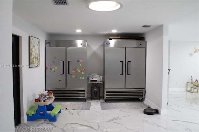 interior space with high quality fridge, gray cabinetry, and fridge