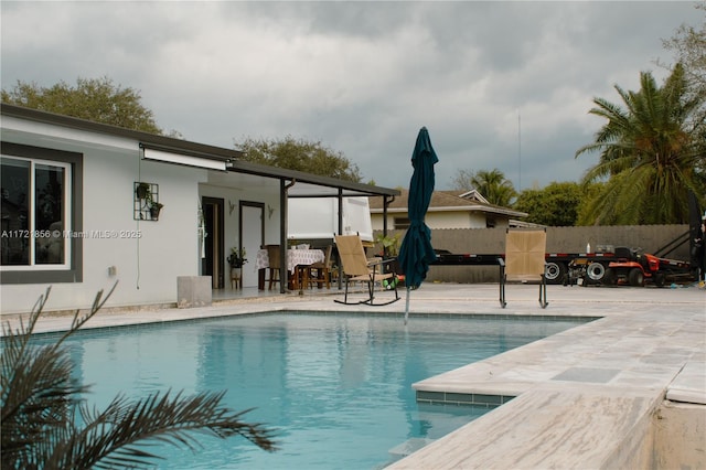 view of pool featuring a patio