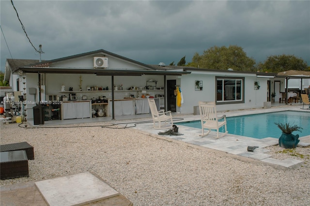 back of property with a patio