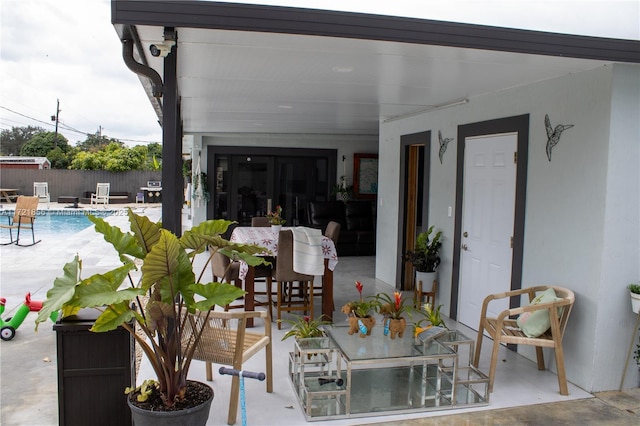 view of patio / terrace with a fenced in pool