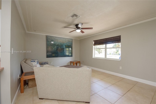 living area with crown molding, light tile patterned floors, a textured ceiling, and ceiling fan