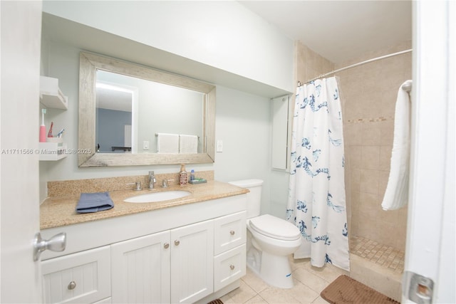 bathroom featuring tile patterned flooring, toilet, vanity, and a shower with shower curtain