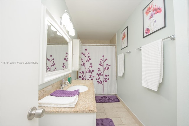 bathroom with tile patterned flooring, vanity, and curtained shower