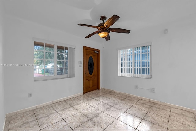 unfurnished room with ceiling fan