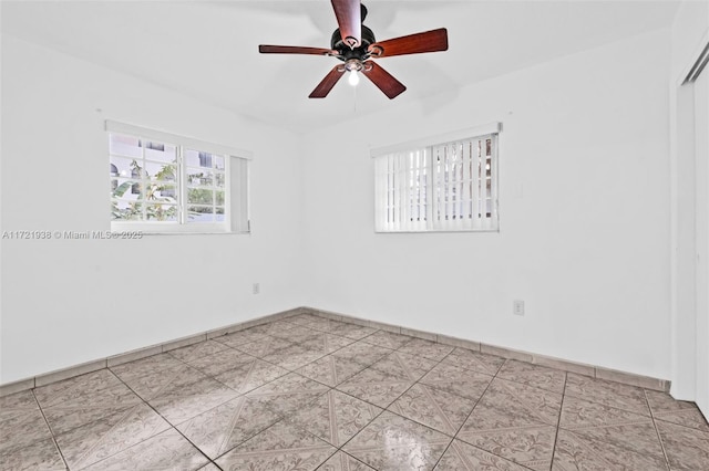 unfurnished room featuring ceiling fan