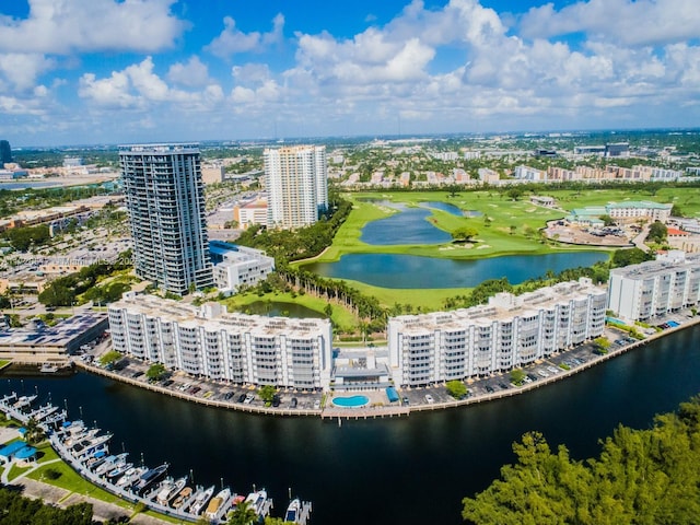 birds eye view of property with a water view and a view of city