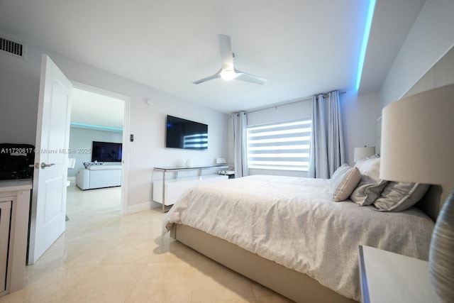 bedroom featuring light tile patterned floors, baseboards, visible vents, and ceiling fan