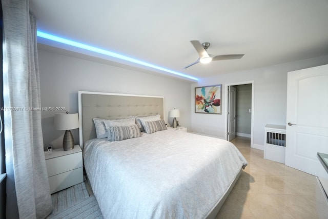 bedroom with light tile patterned flooring, baseboards, and ceiling fan
