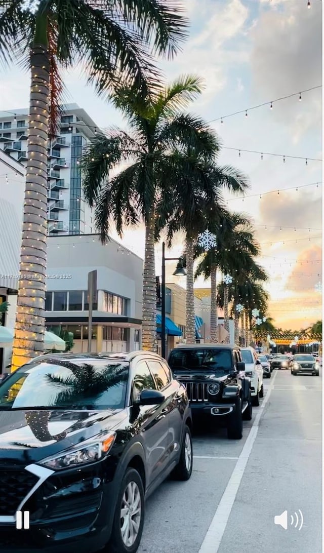 view of parking at dusk