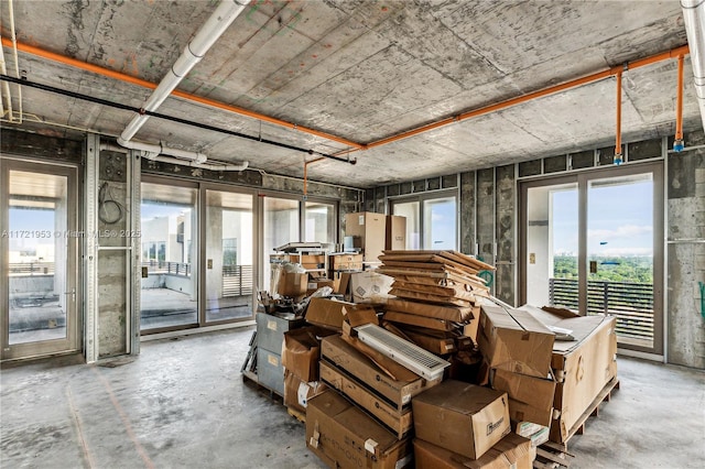 misc room with plenty of natural light and concrete flooring